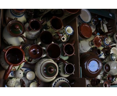 Large collection of Torquay pottery wares, including jug, pots, candle sticks, plates, toast rack, match strikers etc (2 boxe