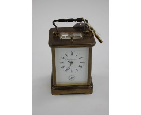 A Matthew Norman, English carriage clock, early 20th Century with key (2) brass cased 