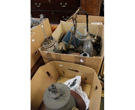A mid 20th Century industrial ceiling lamp, with assorted brass ceiling lamps, oil lamps, metalware, etc and a copper and cas