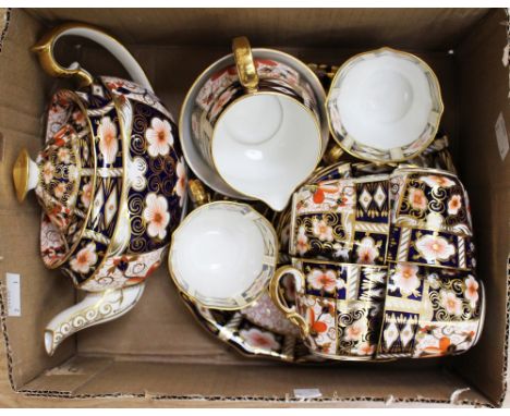 A Royal Crown Derby 2451 Imari part tea service, including teapot, milk, sugar, cake plate, six cups and saucers (one box)