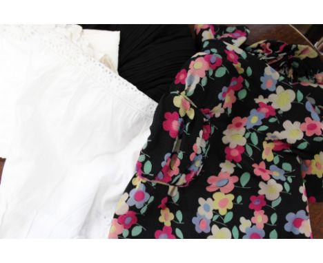 A long black Edwardian georgette top with lace scallop edging and deep hem details, also 1940s silk print blouse in black and