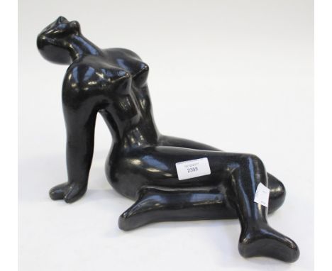 A ceramic model of a nude in reclining position 