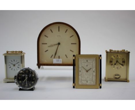 A oak cased Smiths clock; together with a Baby Ben alarm clock, two battery operated carriage clocks and another (5) 