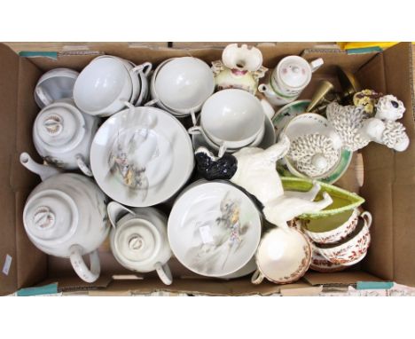 A Japanese porcelain tea service, together with models of a spanniel and a poodle and other ceramics 