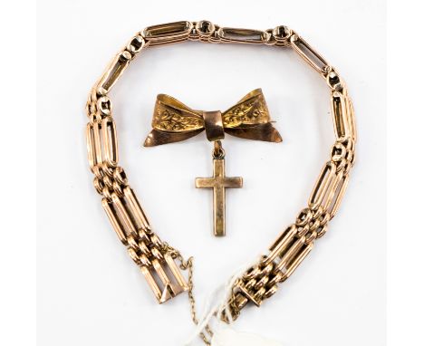 A 15ct rose gold gate bracelet, 17.2 grams approx. together with a rose gold 9ct bow and cross brooch 3.7 grams approx 