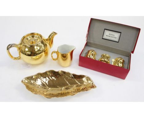 A Royal Worcester gilded three piece cruet set, with mustard spoon, a matching teapot and milk jug and a Royal Winton leaf di