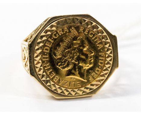 A 9ct ring, set with a Half Sovereign, weighing approx 9.1 grams 