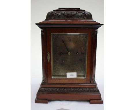 A mahogany cased bracket clock with Roman numerals and scroll work to dial and carving and trellis work to case (1)
