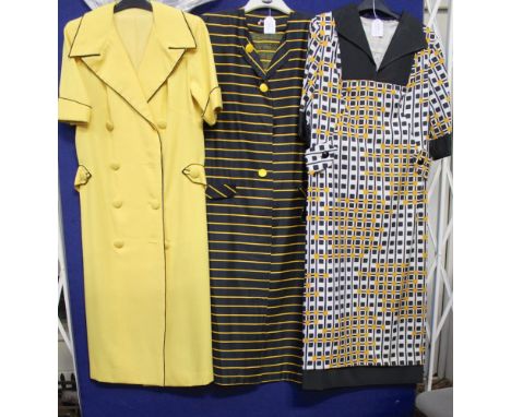 One white/black sundress with a matching stole, a black/white cotton dress, a black/mustard pattern day dress, a black cotton