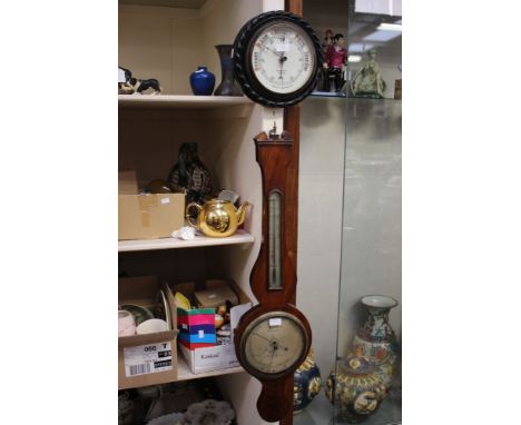 An early 20th Century mahogany banjo barometer with thermometer; together with a circular aneroid barometer marked 'Benetfink