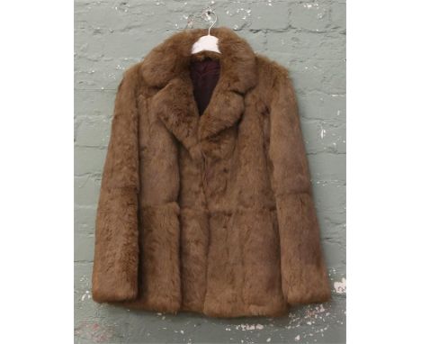 A ladies rabbit skin fur coat.