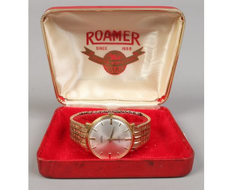 A gents Roamer gold plated manual bracelet watch with satin dial and baton markers.