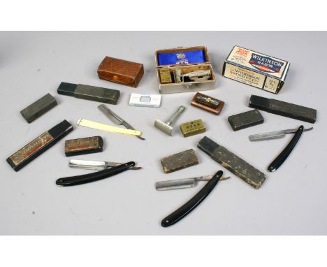 A tin of shaving related items to include cut throat razor, Wilkinson razor etc.