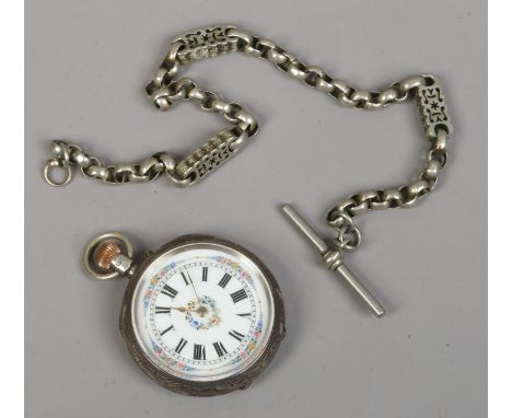 A Victorian silver fob watch with engraving to the case, white enamel dial with gilt decoration and Roman numeral markers, al