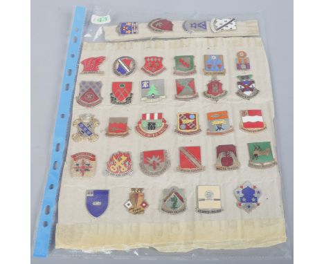 Thirty three military European enamel badges.