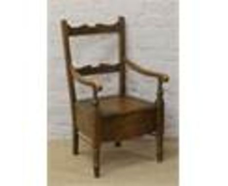 A mahogany carver commode.