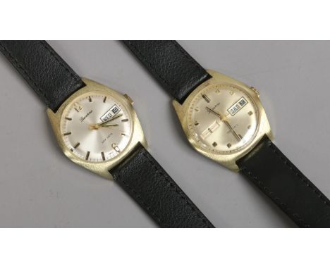Two gentleman's Lucerne day date manual wristwatch each with baton markers and centre seconds.