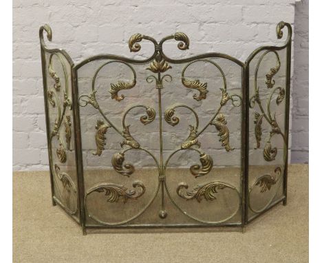 An ornate folding fireguard.