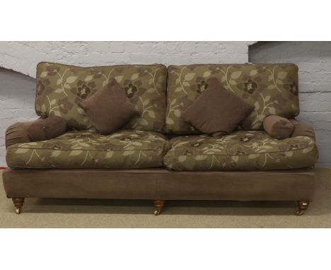 A purple and grey three seater Duresta sofa.