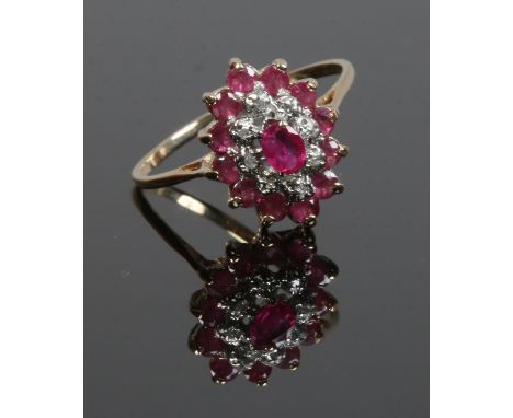 A 9ct gold ruby and diamond cluster ring, size Q1/2.