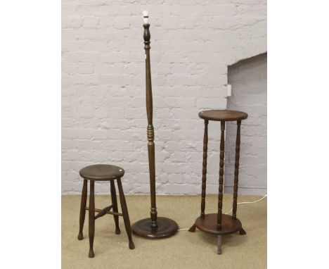 A turned mahogany standard lamp, along with a bobbin turn jardiniere stand and wooden stool.
