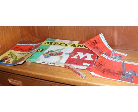 A vintage Meccano set No. 4 in original box with various catalogues.