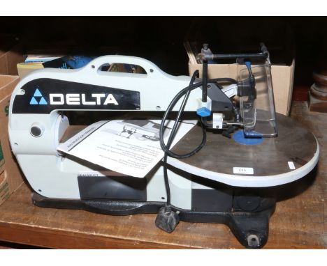 A Delta variable speed scroll saw with instruction manual.