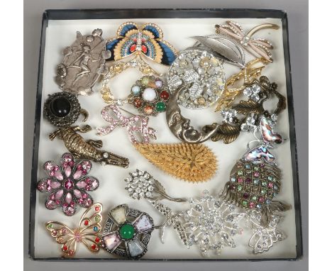 A quantity of costume brooches including Celtic and enamel examples.