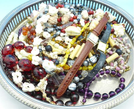 A rose quartz bead necklace with silver clasp, plated brooch and other bead necklaces in a plated tray