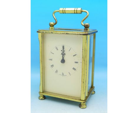 A brass and glass carriage clock