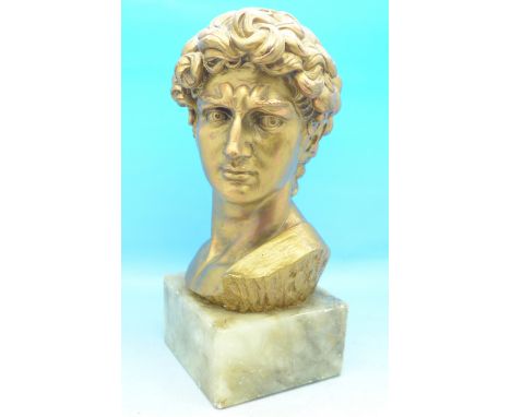 An Italian gilded bust, after G. Corusi, on a marble base