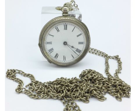 A silver long guard chain with a lady's silver fob watch