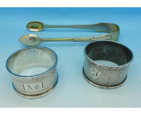 Two silver napkin rings and a pair of Victorian silver sugar bows, 102g