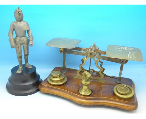 A set of postal scales and a novelty figural knight table lighter, lighter a/f