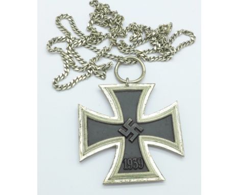 A German WWII Iron Cross Second Class marked 1813 and 1939, on a silver chain