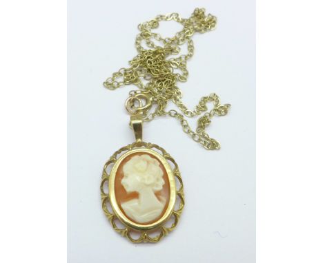 A 9ct gold mounted cameo pendant on a yellow metal chain, 2.2g