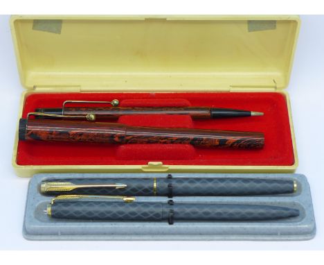 A Parker fountain pen with 14ct gold nib and ballpoint pen set and a pen and pencil set, the pen with 14ct gold nib