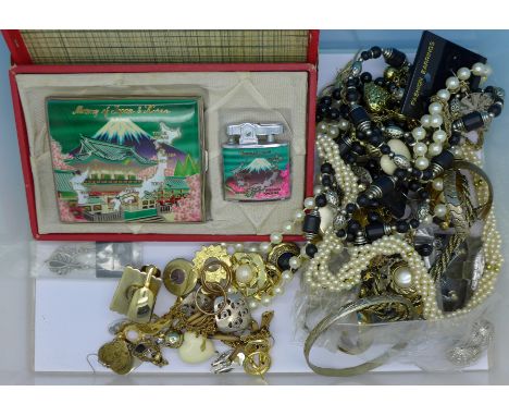 Assorted costume jewellery and a boxed cigarette case and lighter