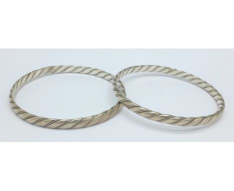 Two silver bangles stamped .900, 41g
