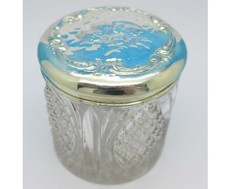 A silver topped glass jar with cherubs, Birmingham 1906