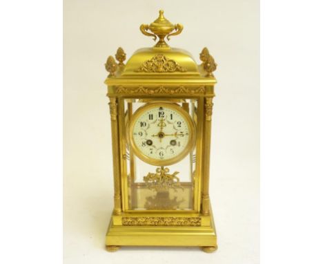 A FRENCH GILT BRASS FOUR GLASS MANTLE CLOCK WITH PRIMROSE ENAMEL DIAL, LATE 19TH CENTURY