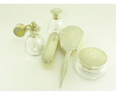 A SILVER FIVE PIECE DRESSING TABLE SET, ENGINE TURNED, BIRMINGHAM 1948 AND 1949