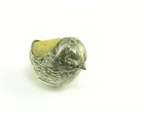 AN EDWARD VII SILVER NOVELTY PIN CUSHION IN THE FORM OF A NEWLY HATCHED CHICK, CHESTER, DATE LETTER RUBBED, CIRCA 1905