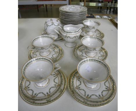 A CONTINENTAL PORCELAIN TEA SERVICE DECORATED WITH GREEN AND  GILT SWAGS, AND A TRAY