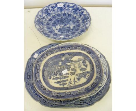 A DUTCH DELFTWARE DISH, EARLY 19TH CENTURY AND SIX 19TH CENTURY AND LATER BLUE AND WHITE WILLOW PATTERN AND OTHER DISHES