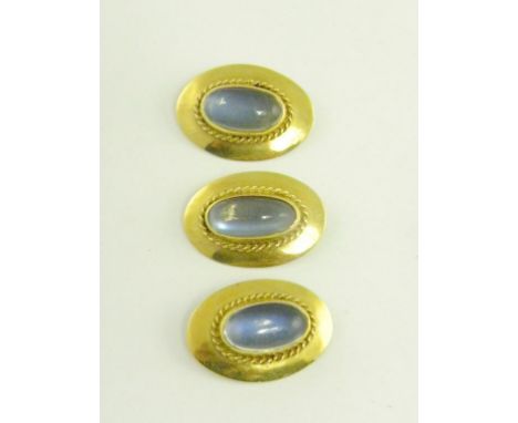 THREE OVAL MOONSTONE CABOCHON SET GOLD BUTTONS, EARLY 20TH CENTURY, FORMERLY PART OF A PAIR OF CUFFLINKS, 8.1G