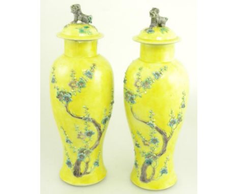 A PAIR OF CHINESE YELLOW GROUND 'FAHUA' VASES AND COVERS, MOULDED WITH PRUNUS, DOG OF FO, KNOP, SEAL MARK
