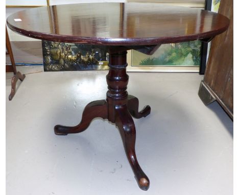 A Georgian mahogany tripod table on pedestal and tripod base