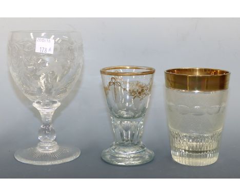 A 19th century cut glass wine with gilt rim and 2 others