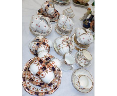 A 1920's bone china tea service, 21 pieces; 5 similar part tea services